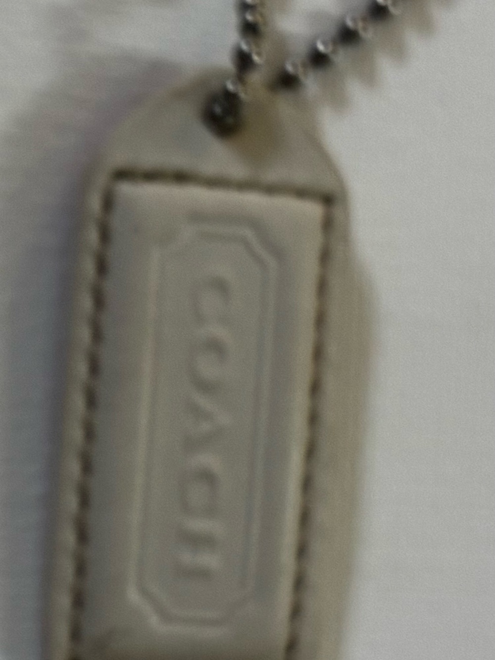 Coach off white (cream/gray) & Mauve Leather hang tag / key chain &2”